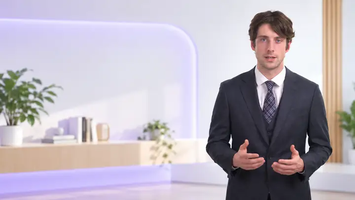 A calm professional speaking directly to viewers in an informative video.